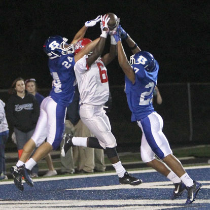 Nick Hardin (24) and Steven Murdock (27) prevent a touchdown catch by McClellan's Kenneth Buffington. (Photo by Rick Nation)