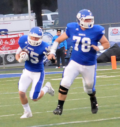 Paul Tierney (35) follows teammate Devin Waite (78). (Photo by Kevin Nagle)