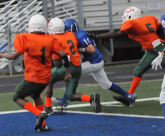 Quarterback Jesse Windemaker dashes across the goal line just inside the pylon as three Cloverdale defenders pursue. (Photo by Kevin Nagle)