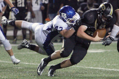 Hornets defensive end Ryan Hall sacks Central quarterback Cooper Westbrook. (Photo by Rick Nation)