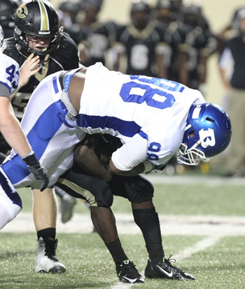 Bryant defensive tackle Cameron Murray buries Central running back Richard Hayes for a loss. (Photo by Rick Nation)