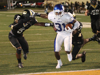 Sevante Turner stiff-arms a Central defender on his way into the end zone. (PHoto by Rick Nation)