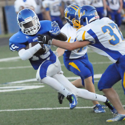 Chace Henson (15) tries to evade a Lakeside tackler. (Photo by Kevin Nagle)