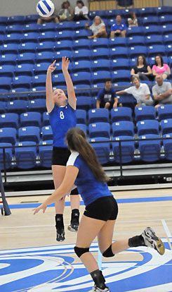 Britney Sahlmann (8) sets. (Photo by Kevin Nagle)