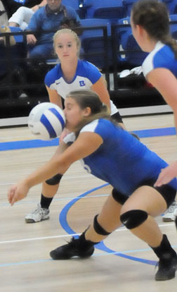 Kaci Squires tries to dig up a hit next to Whitney Brown, Bryant's libero. (PHoto by Kevin Nagle)