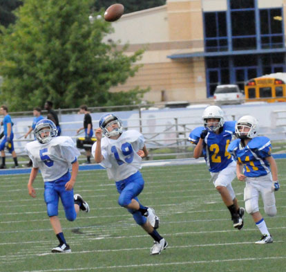 Ryan Riedmueler (19) and Logan Hubbard (5) try to run underneath a pass during Tuesday's game. (Photo by Kevin Nagle)