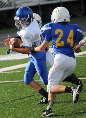 Bethel quarterback Jake Meaders sprints past Immaculate Conception linebacker Gray Rahbany on his way to the end zone. (Photo by Kevin Nagle)