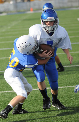 Dalen McDonald powers past Immaculate Conception defender Riley Russell on the way to the end zone. (Photo by Kevin Nagle)