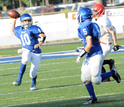 Bryant White quarterback Jesse Windemaker (10) draws a bead on receiver Brandon Jett (5). (Photo by Kevin Nagle)