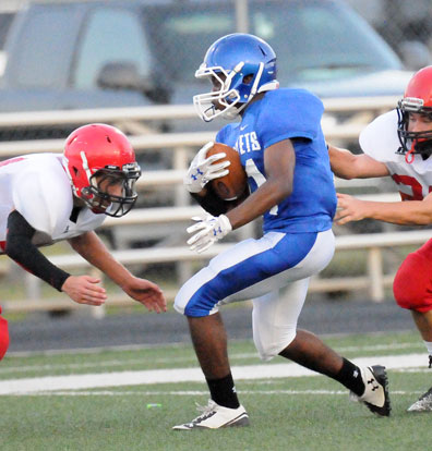 Diante Woodson tries to split a pair of Cabot defenders. (Photo by Kevin Nagle)