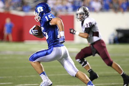 Ben Bruick (15) heads upfield after this second-quarter interception as quarterback Cason Maertens pursues. (Photo by Rick Nation)