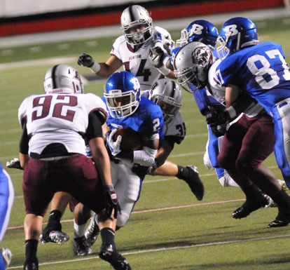 Brushawn Hunter (2) looks to get past Benton's Dylan Murphy (92). (Photo by Kevin Nagle)