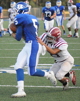 Austin Kelly hauls in a pass behind a Pine Bluff defender. (Photo by Kevin Nagle)