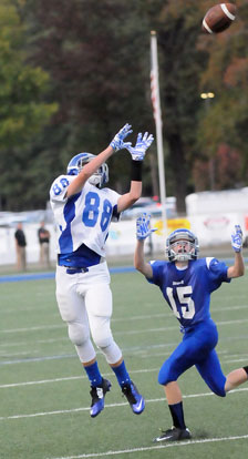 Logan Grant (88) goes up for a pass in front of Sam Perryman (15). (Photo by Kevin Nagle)