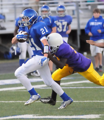 Grant Botti (21) scored on a 37-yard run Tuesday. (Photo by Kevin Nagle)