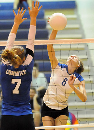 Allie Anderson (6) tries to get a hit past a Conway defender. (Photo by Kevin Nagle)