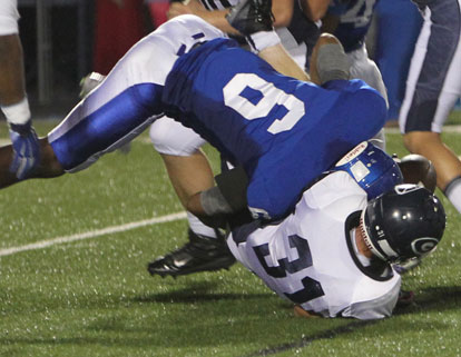 Brenden Young (6) forces Greenwood's Jordan Green to fumble. (Photo by Rick Nation)