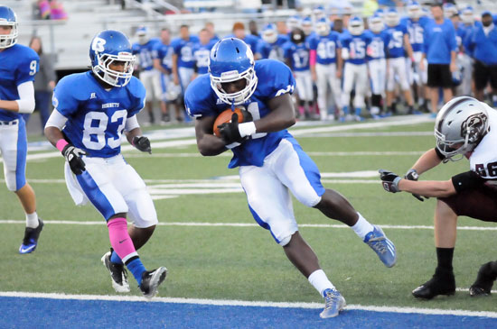 Cameron Coleman scores with Najee Hunt (83) providing an escort. (Photo by Kevin Nagle)