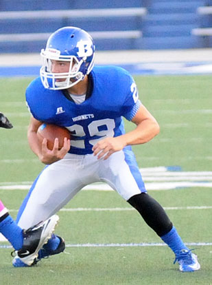 Landon Smith looks for running room. (Photo by Kevin Nagle)