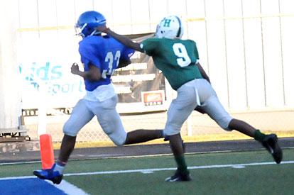 Ahmad Adams (33) finishes off one of his three touchdown runs. (Photo by Kevin Nagle)