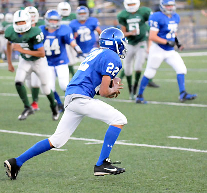 Andrew Hayes (22) heads upfield after the first of his two interceptions. (Photo by Kevin Nagle)