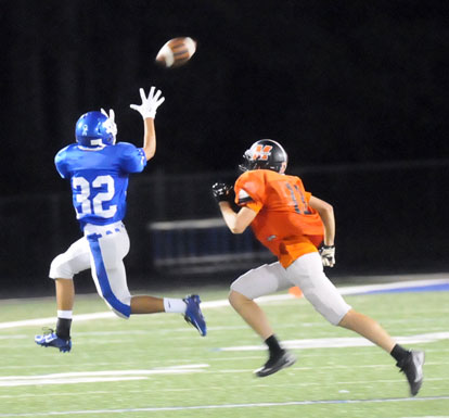 Jalen Hernandez (32) hauls in a pass in front of a Malvern defender. (Photo by Kevin Nagle)