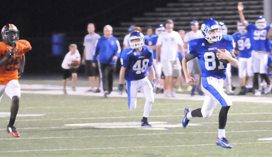 Seth Tucker (81) heads downfield on one of his three touchdown runs with an escort from Jessy Smith. (Photo by Kevin Nagle)