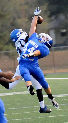 Bryant's Parker Littleton (44) tries to break up a Conway Blue pass to Rickey Fuller. (Photo by Kevin Nagle)