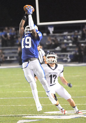 Kylon Boyle (19) goes high for a pass against Greenwood. (Photo by Kevin Nagle)