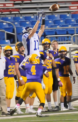 Evan Lee leaps hit for a pass as Catholic's Cole Moore defends. (PHoto by Kevin Nagle)