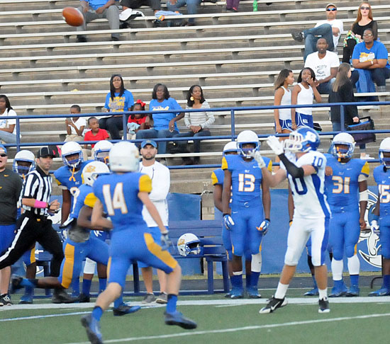 Jordan Gentry (10) looks back for a pass as North Little Rock defenders close in. (Photo by Kevin Nagle)