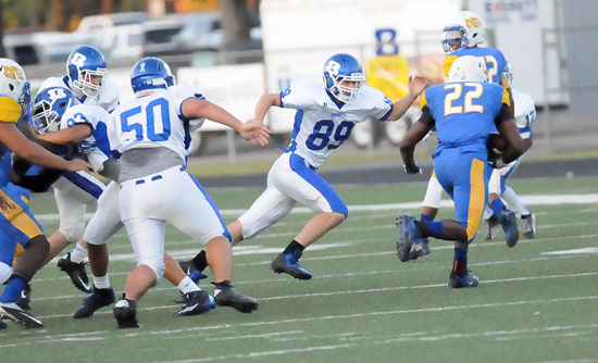 Jake Hall (89) pursues a North Little Rock ballcarrier with Dany Murillo (50) and Madre Dixon (93) trying to clear to help out as Lowell Washington (17) tries to get into position for a tackle. (Photo by Kevin Nagle)