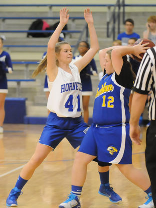 Kinley Oholent (41) defends against a Sheridan player during Tuesday's seventh grade girls game. (Photo by Kevin Nagle)