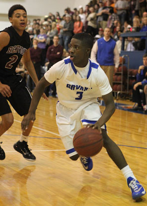 Bryant point guard Calvin Allen (3) drives around Benton's Clay Anderson (2). (Photo by Rick Nation)