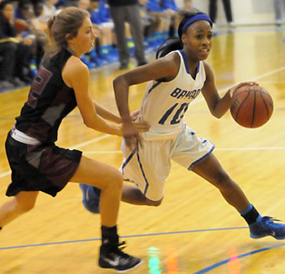 Bryant's Jakeria Otey (10) tries to drive around Benton's Braxton Chumley. (Photo by Kevin Nagle)