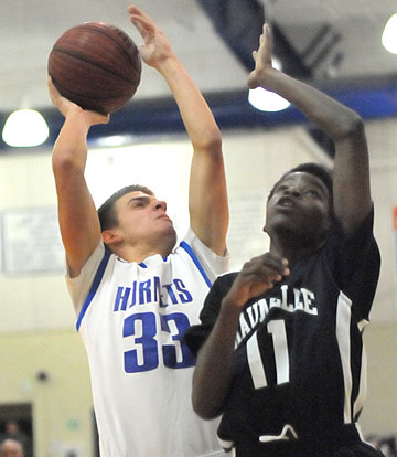 Brooks Ellis (33) shoots over Maumelle's Terrell Curtis. (Photo by Kevin Nagle)