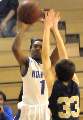 Brandon Murray launches a jumper over Pulaski Academy's Ryan Burgess. (Photo by Kevin Nagle)