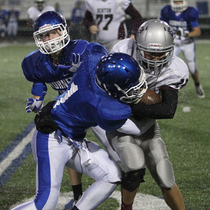 Bryant's Jakalon Pittman (1) tackles Benton's Beau Brewer. (Photo by Rick Nation)