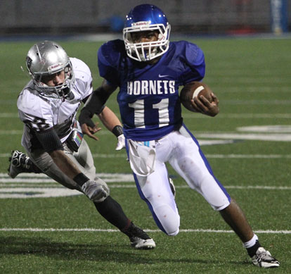 Diante Woodson rushed for 120 yards and a touchdown Tuesday night. (Photo by Rick Nation)