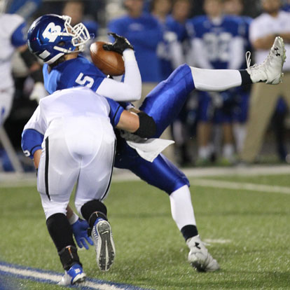 Austin Kelly (5) hauls in a clutch catch. (Photo by Rick Nation)