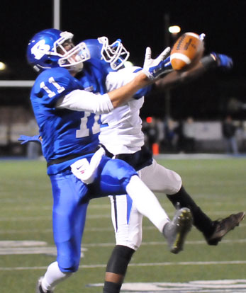 Evan Lee (11) battles with Conway's Michael Garlington. (Photo by Kevin Nagle)