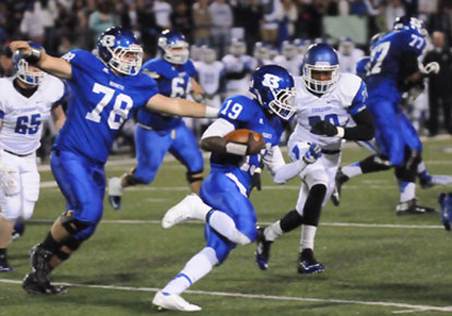 Kylon Boyle (19) takes advantage of a block by Devon Waite (78) and Cameron Davis (77). (Photo by Kevin Nagle)