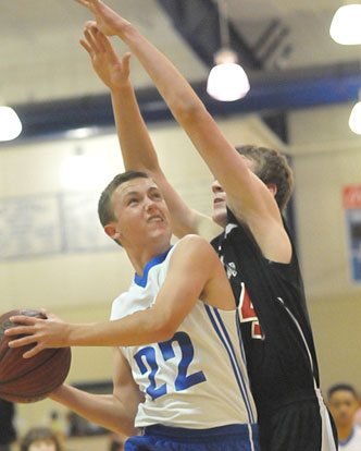 Tyler O'Neal tries to drive around a Russellville defender. (Photo by Kevin Nagle)