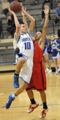 JonLuke Sprout (10) twist to get a shot away over a Russellville defender. (Photo by Kevin Nagle)