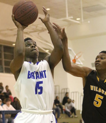 Ketrick Wilson gets inside a Watson Chapel defender on the way to the basket. (Photo by Rick Nation)