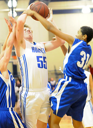 Blaine Smith (55) tries to power up for a shot in traffic. (Photo by Kevin Nagle)