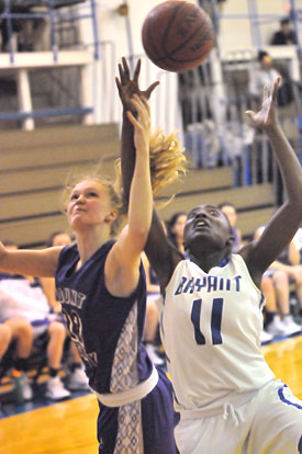 Lauren Carroll (11) battles for a rebound. (Photo by Kevin Nagle)