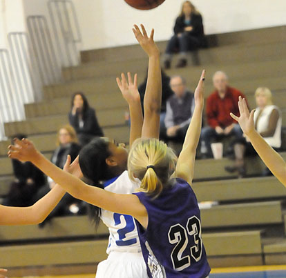 Destiny Martin (2) gets a shot away in traffic. (Photo by Kevin Nagle)