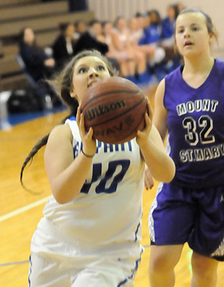 Morgan Walters drives to the basket. (Photo by Kevin Nagle)