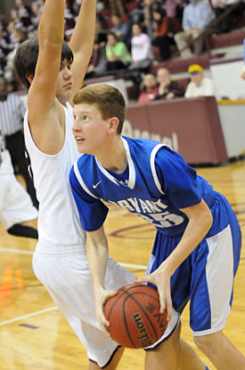 Luke Curtis looks for room to shoot. (Photo by Kevin Nagle)